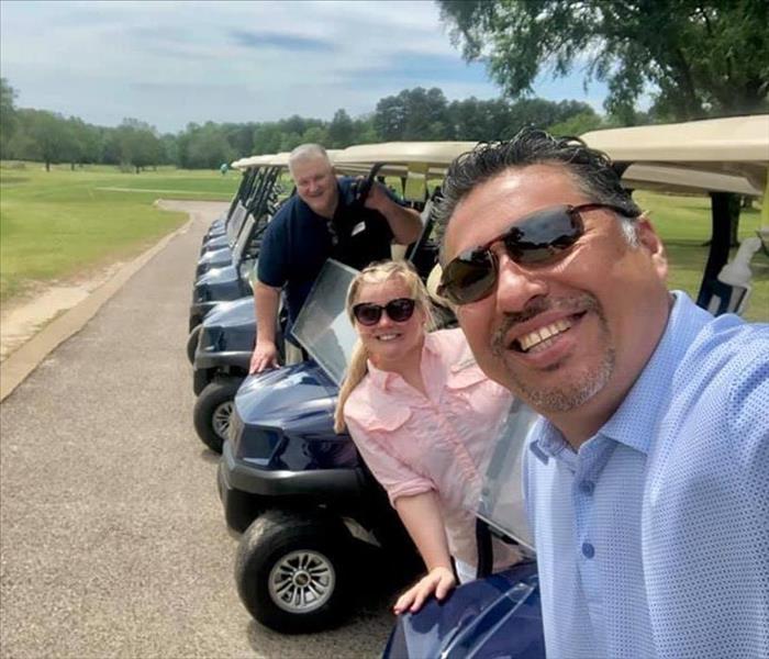 SERVPRO employees in golf carts