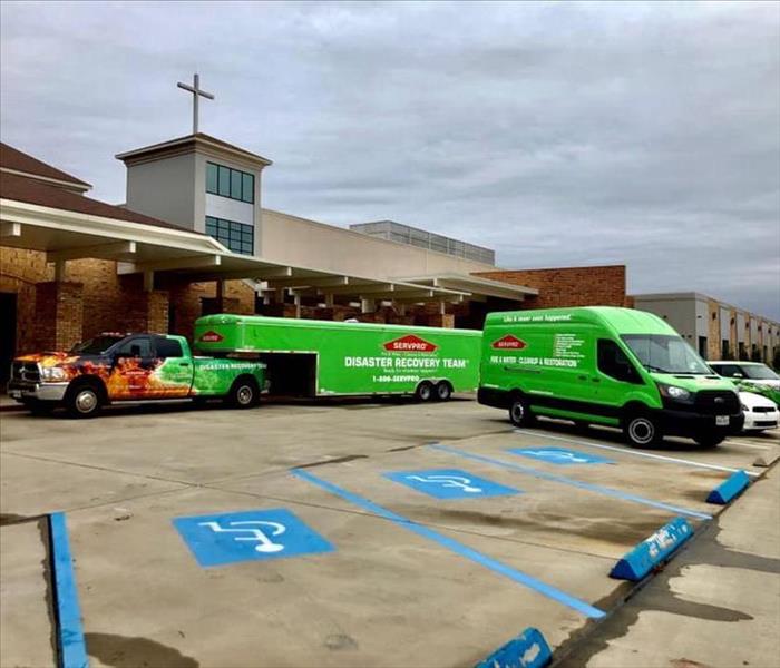 Emergency vehicles parked in front of church. 