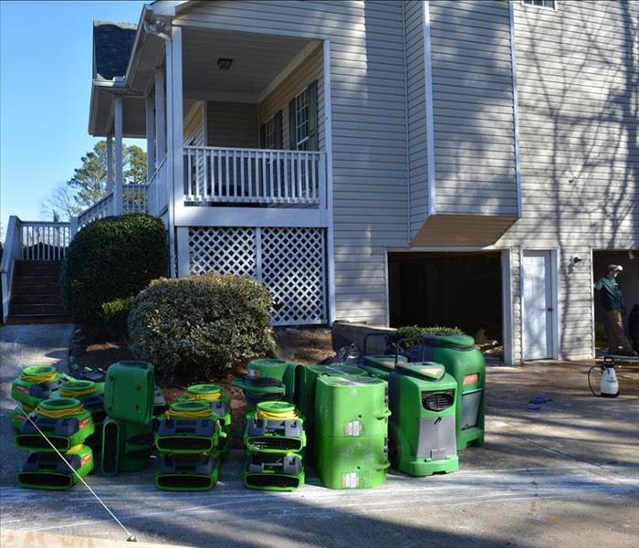 Water damaged home with drying equipment 