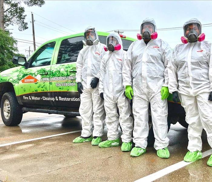 SERVPRO technicians in front of vehicle 