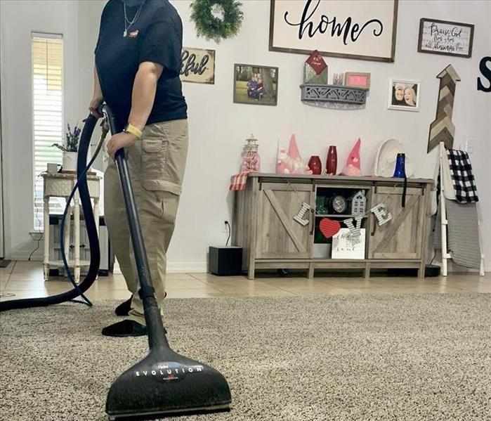 SERVPRO employee cleaning carpet