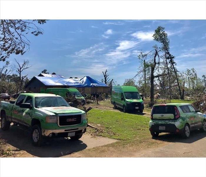 SERVPRO vehicles on scene after a bad storm.