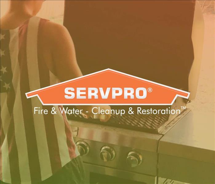 Male grilling with SERVPRO logo 